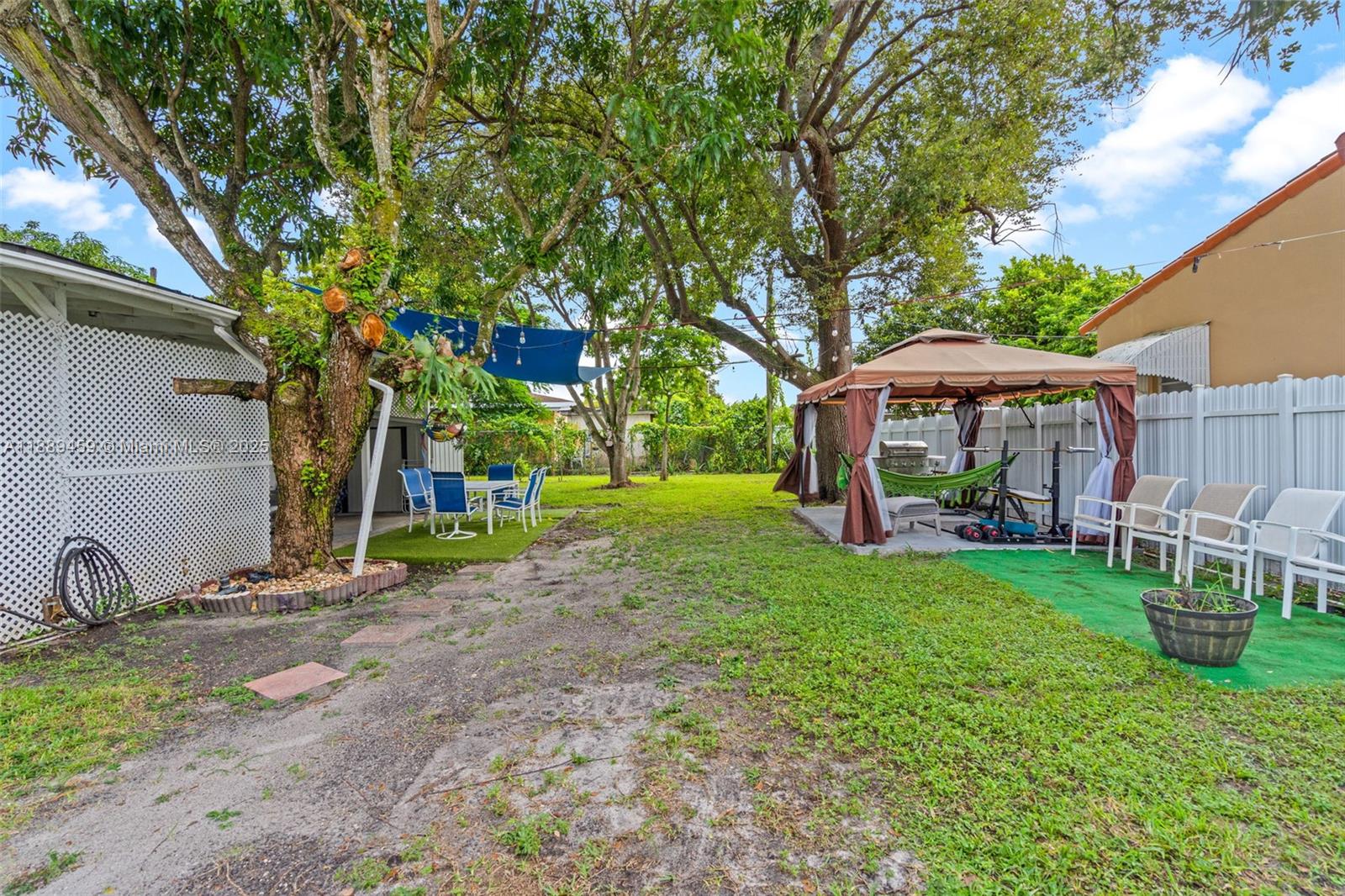 5340 Southwest 5th Street Miami, FL 33134 - Photo 28 of 43 a view of a house with backyard and sitting area