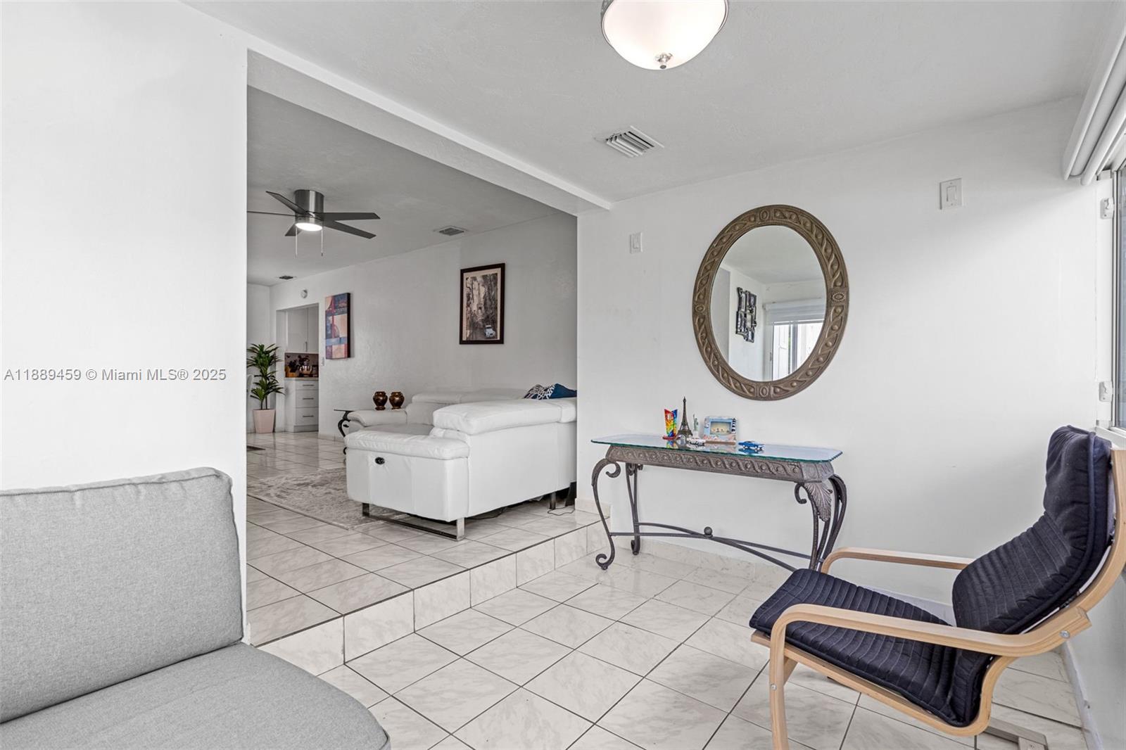 5340 Southwest 5th Street Miami, FL 33134 - Photo 7 of 43 a living room with furniture and a mirror