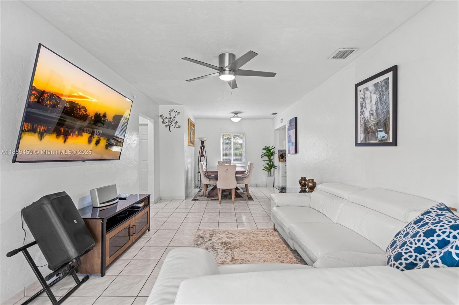 5340 Southwest 5th Street Miami, FL 33134 - Photo 9 of 43 a living room with furniture and a flat screen tv