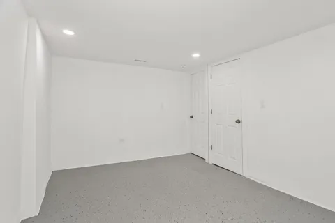 a bathroom with a sink toilet and mirror