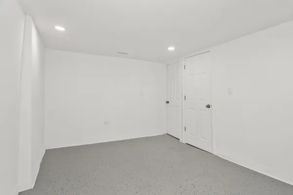 a bathroom with a sink toilet and mirror