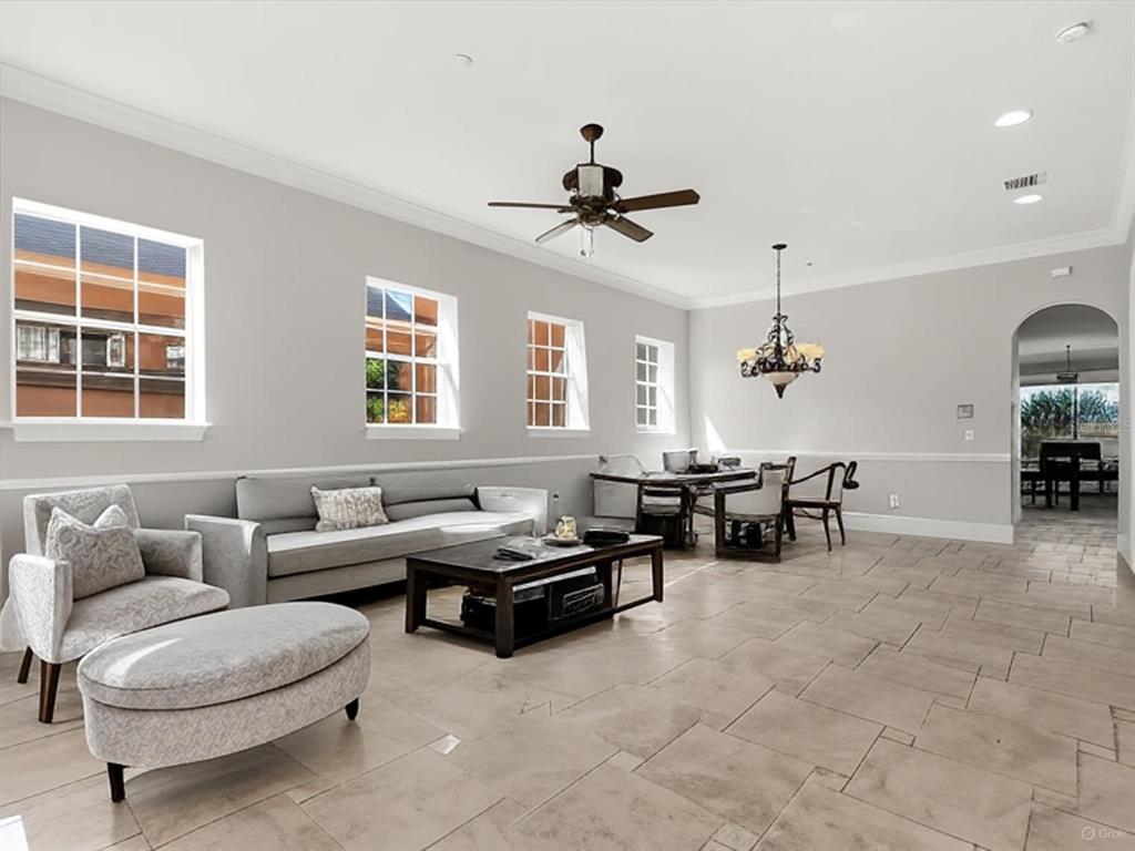 1554 Corolla Court Reunion, FL 34747 - Photo 15 of 71 a living room with furniture and a window