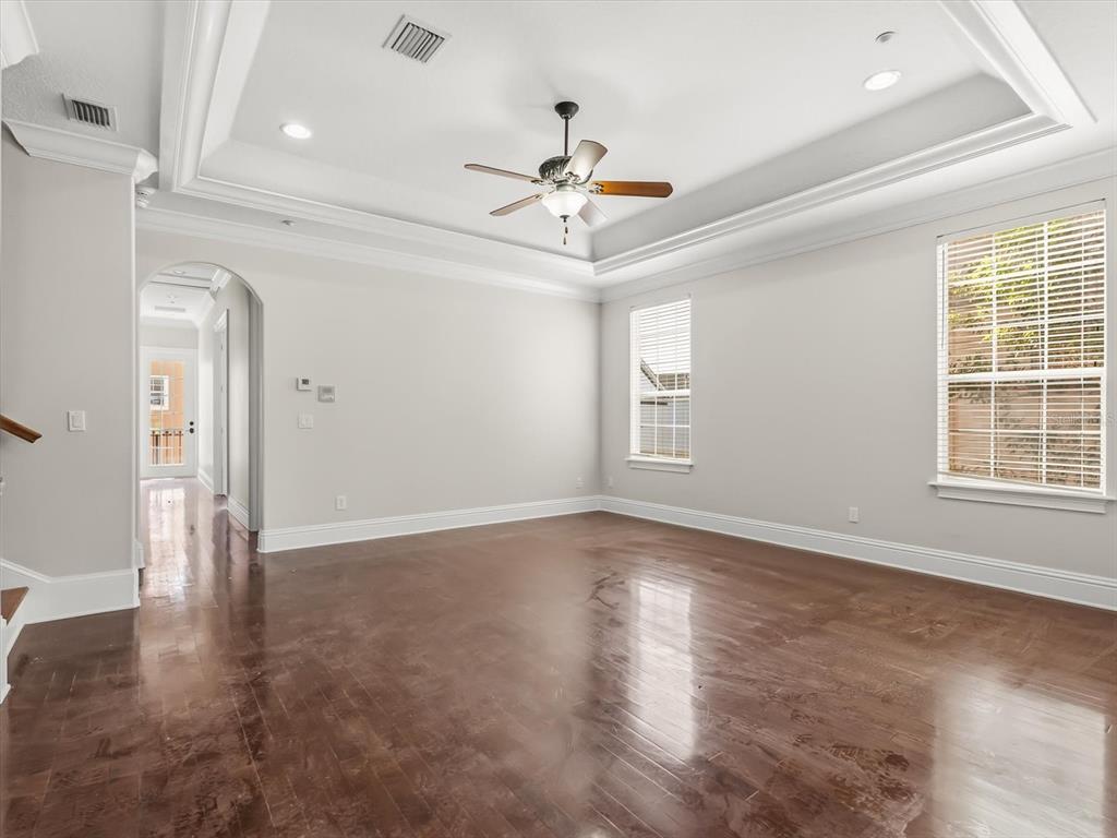 1554 Corolla Court Reunion, FL 34747 - Photo 18 of 71 a view of an empty room with wooden floor and a window