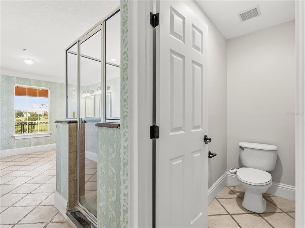 1554 Corolla Court Reunion, FL 34747 - Photo 26 of 71 a bathroom with a toilet and a shower