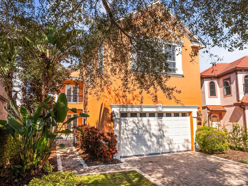 1554 Corolla Court Reunion, FL 34747 - Photo 3 of 71 a front view of a house with garden
