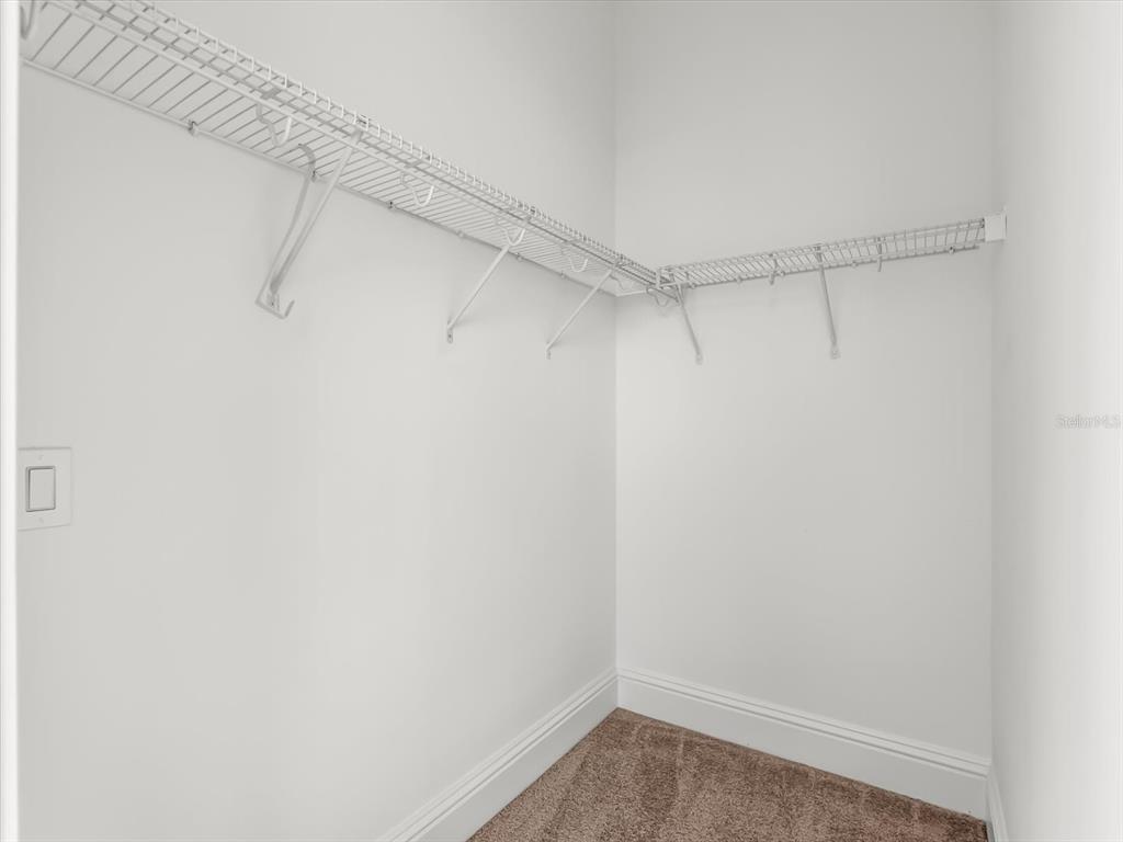 1554 Corolla Court Reunion, FL 34747 - Photo 52 of 75 a view of a room with racks on the wall