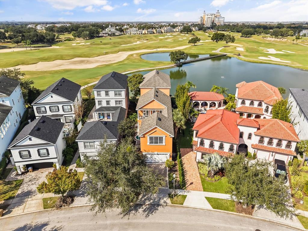1554 Corolla Court Reunion, FL 34747 - Photo 59 of 71 an aerial view of residential houses with outdoor space and ocean view