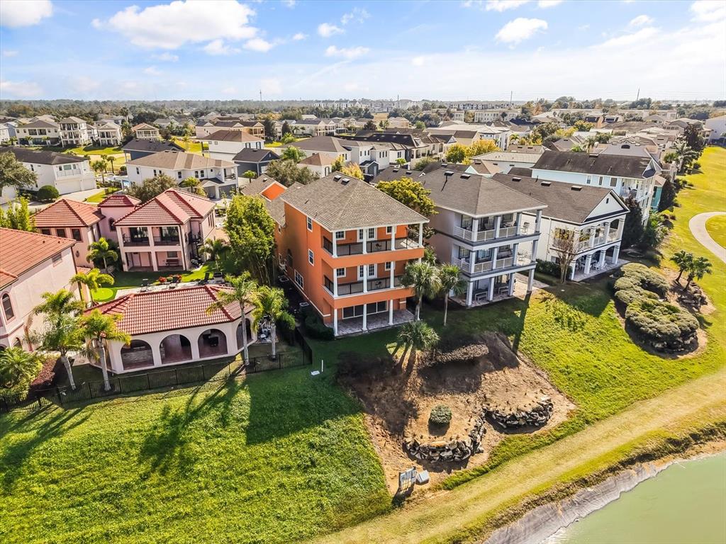 1554 Corolla Court Reunion, FL 34747 - Photo 63 of 71 an aerial view of a house with a garden and lake view