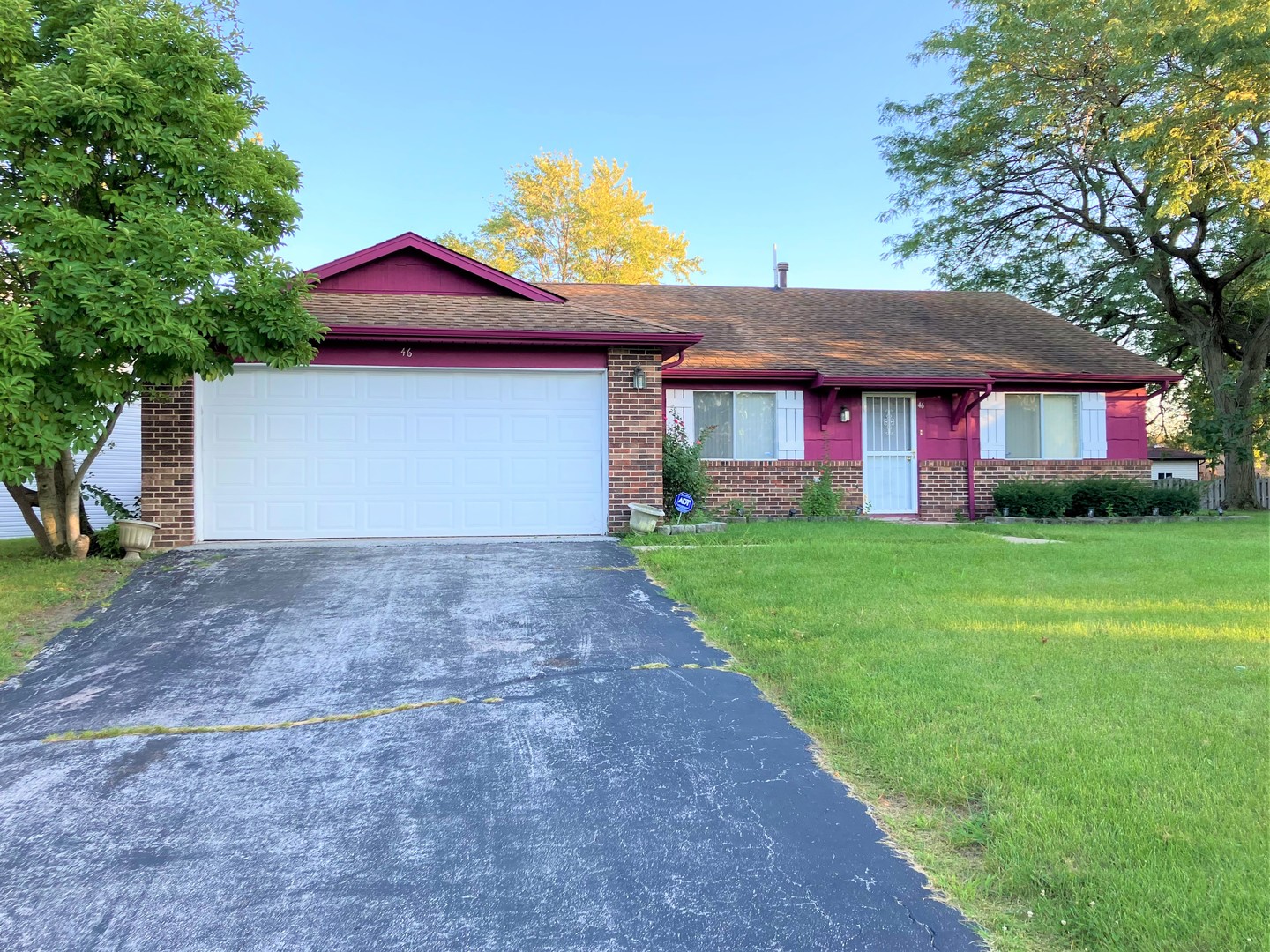 46 Wedgewood Road Matteson, IL 60443 - Photo 1 of 7 a front view of house with yard and green space