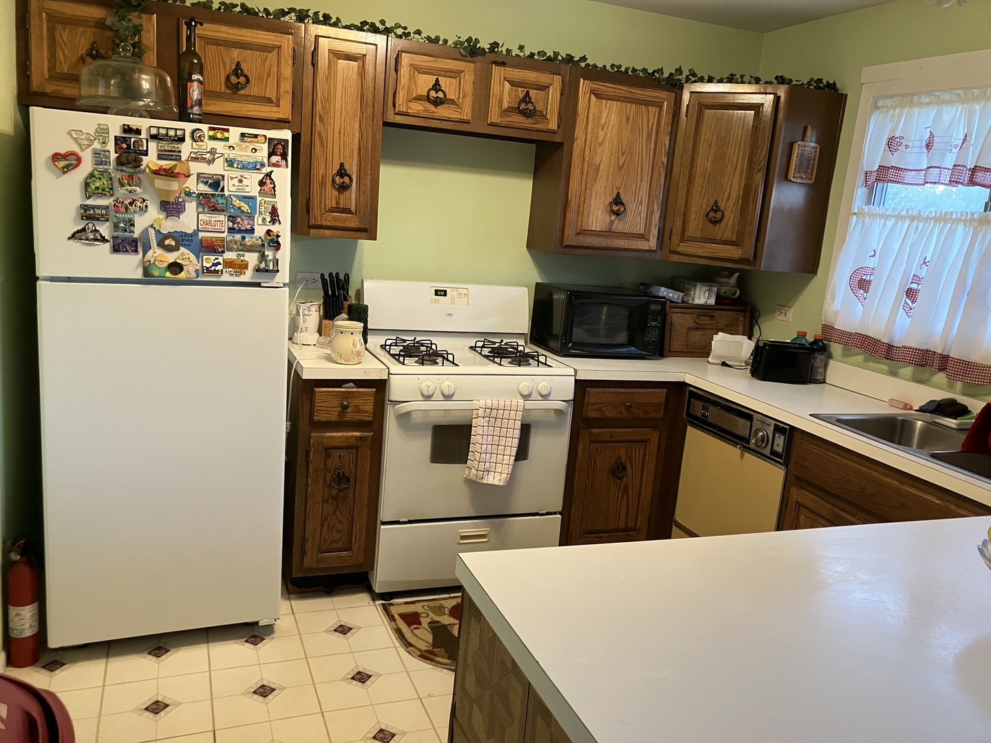 46 Wedgewood Road Matteson, IL 60443 - Photo 3 of 7 a kitchen with stainless steel appliances granite countertop a refrigerator and a stove