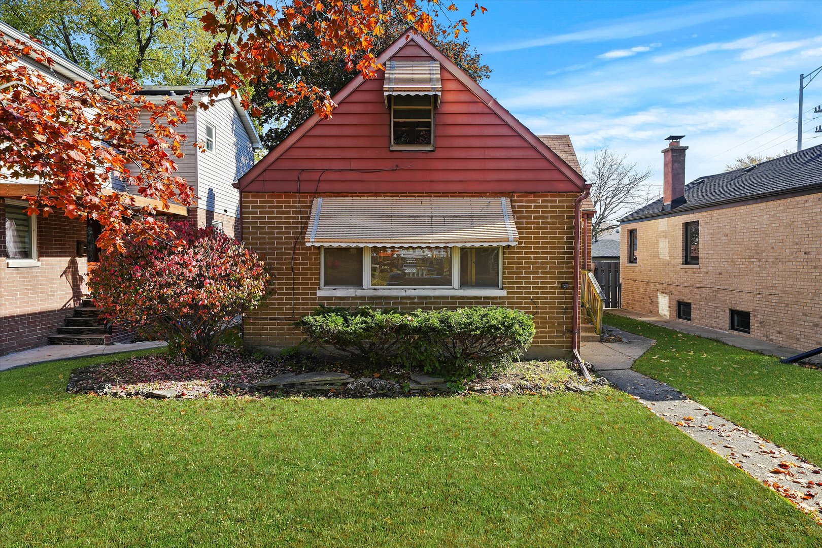 a front view of a house with a yard