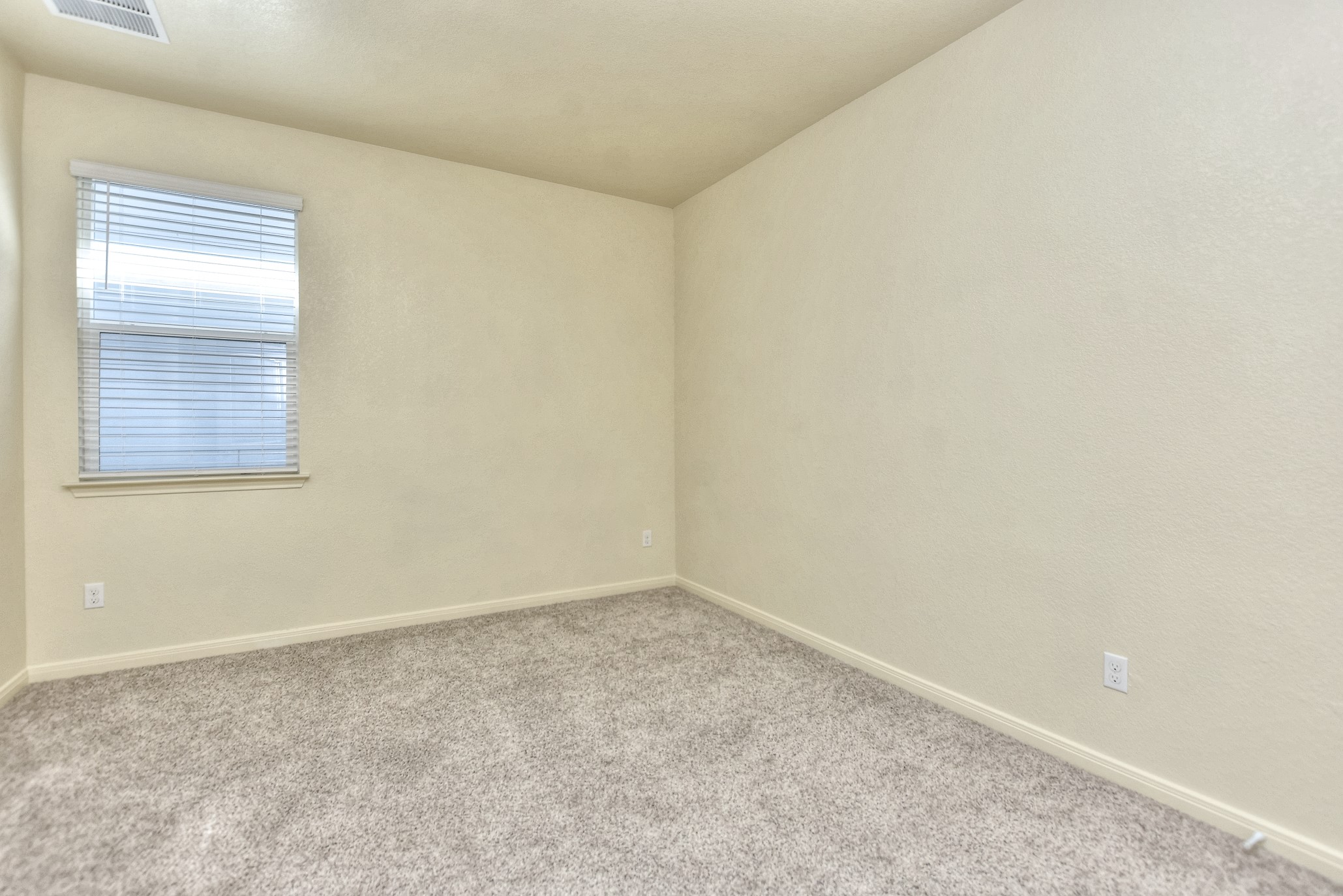 6201 Kildare Drive Georgetown, TX 78626 - Photo 11 of 29 Carpeted spare room featuring baseboards and visible vents