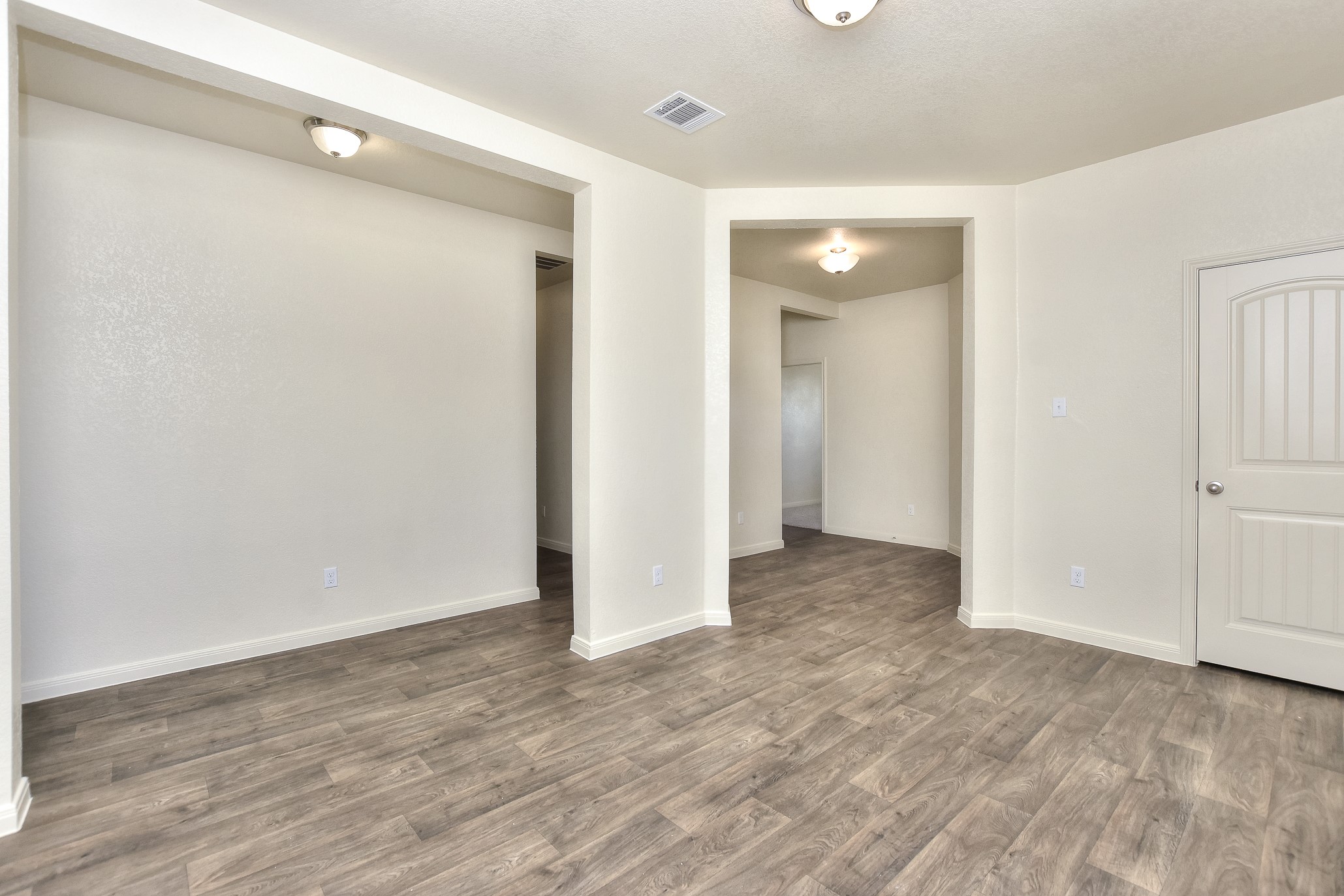 6201 Kildare Drive Georgetown, TX 78626 - Photo 5 of 29 Unfurnished room with baseboards, visible vents, and wood finished floors