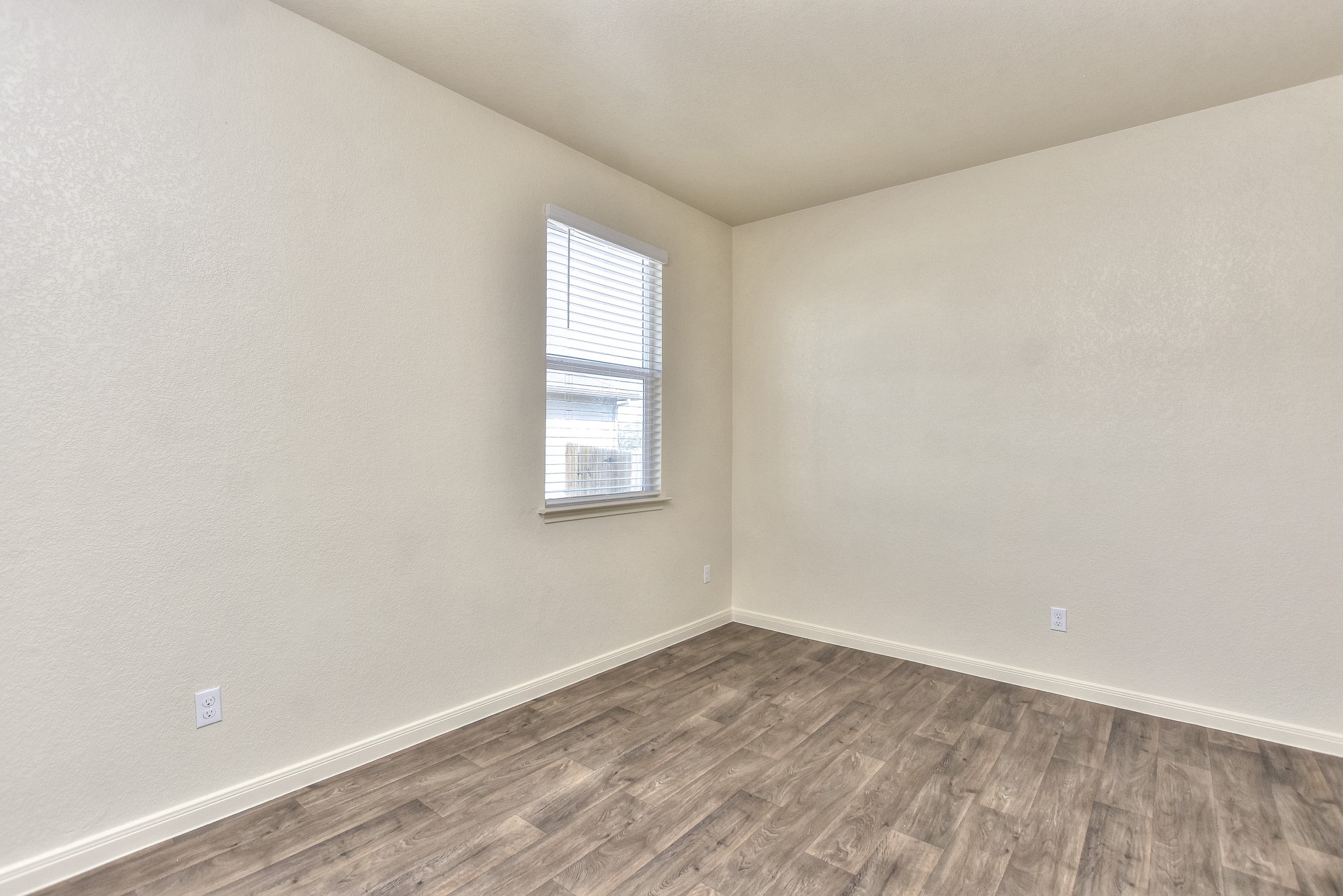 6201 Kildare Drive Georgetown, TX 78626 - Photo 7 of 29 Empty room with baseboards and dark wood finished floors