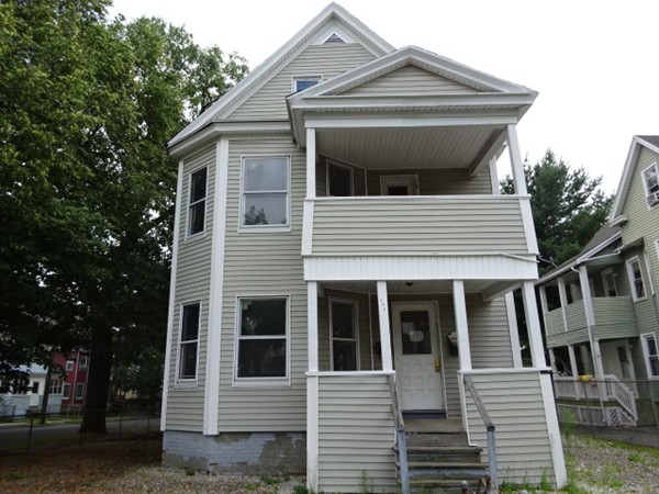 256 White Street Springfield, MA 01108 - Photo 1 of 15 a view of a house with a small yard and large tree