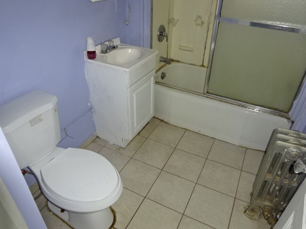 256 White Street Springfield, MA 01108 - Photo 12 of 15 a bathroom with a sink toilet and shower