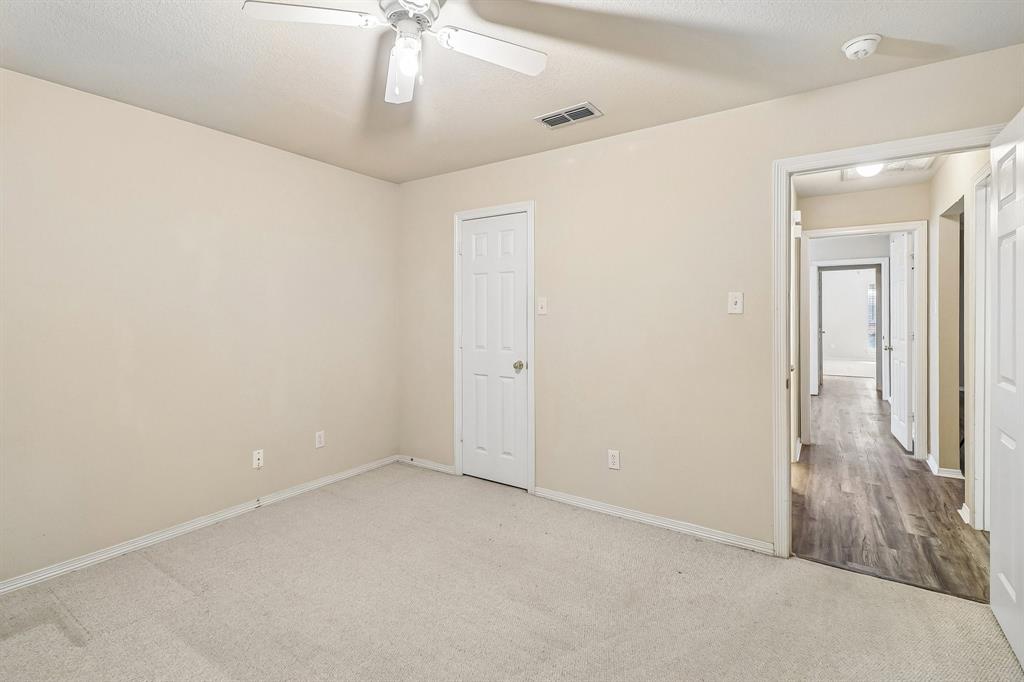 5609 Saddleback Road Arlington, TX 76017 - Photo 12 of 23 en empty room with windows