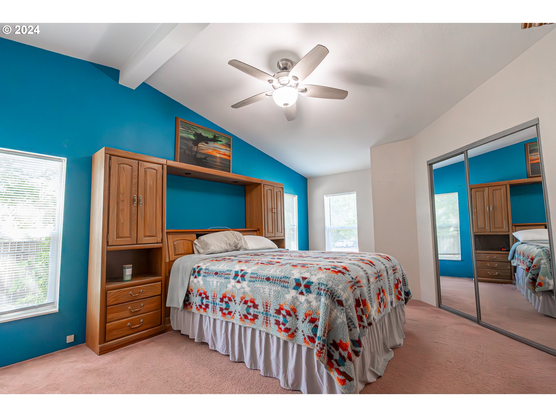 710 North Howe Street Carlton, OR 97111 - Photo 13 of 31 a bedroom with a bed and a chandelier