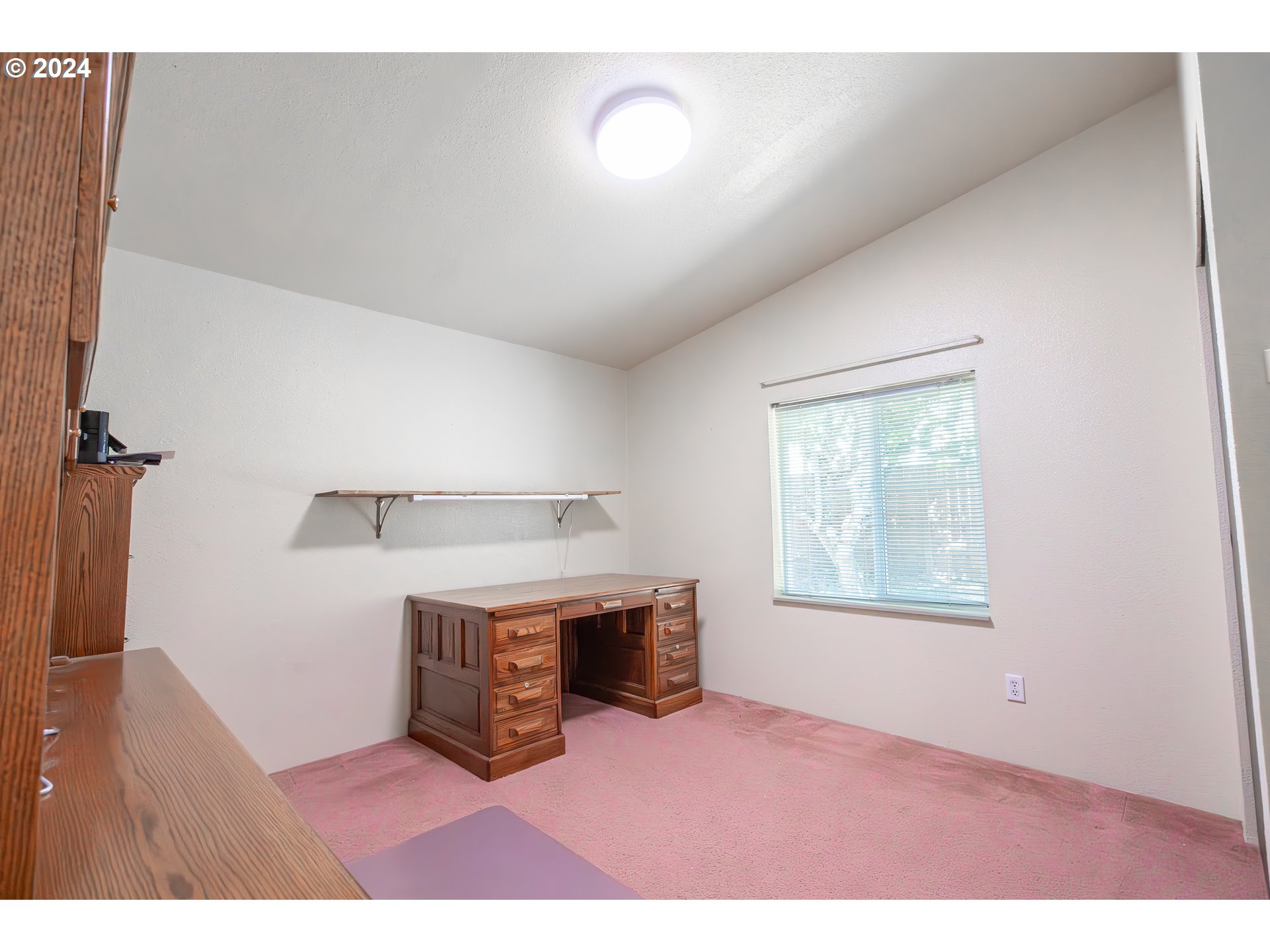 710 North Howe Street Carlton, OR 97111 - Photo 15 of 31 a room with furniture and a window