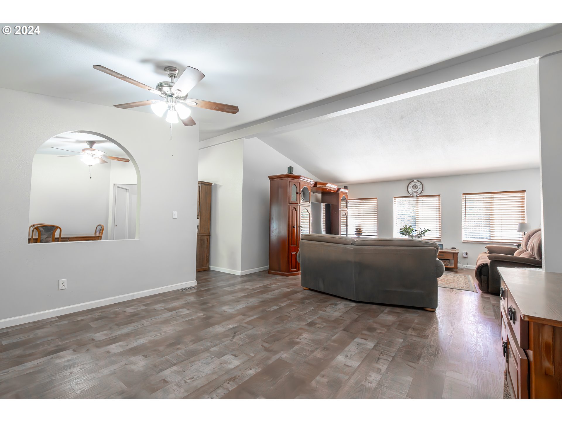 710 North Howe Street Carlton, OR 97111 - Photo 3 of 31 a living room with furniture and wooden floor
