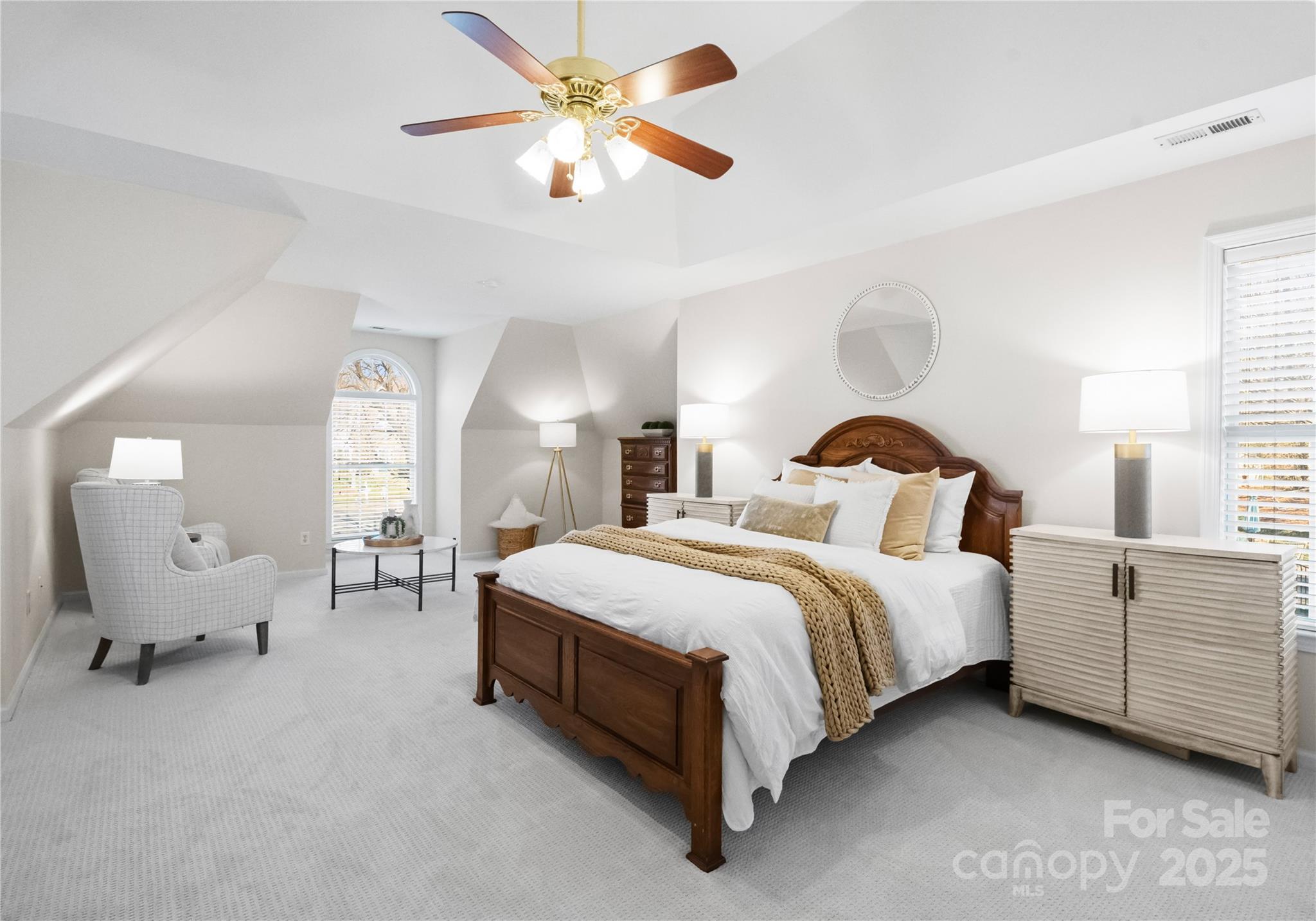 1736 Walnut Crest Lane Matthews, NC 28105 - Photo 22 of 41 a spacious bedroom with a bed chandelier painting on the wall and a large window