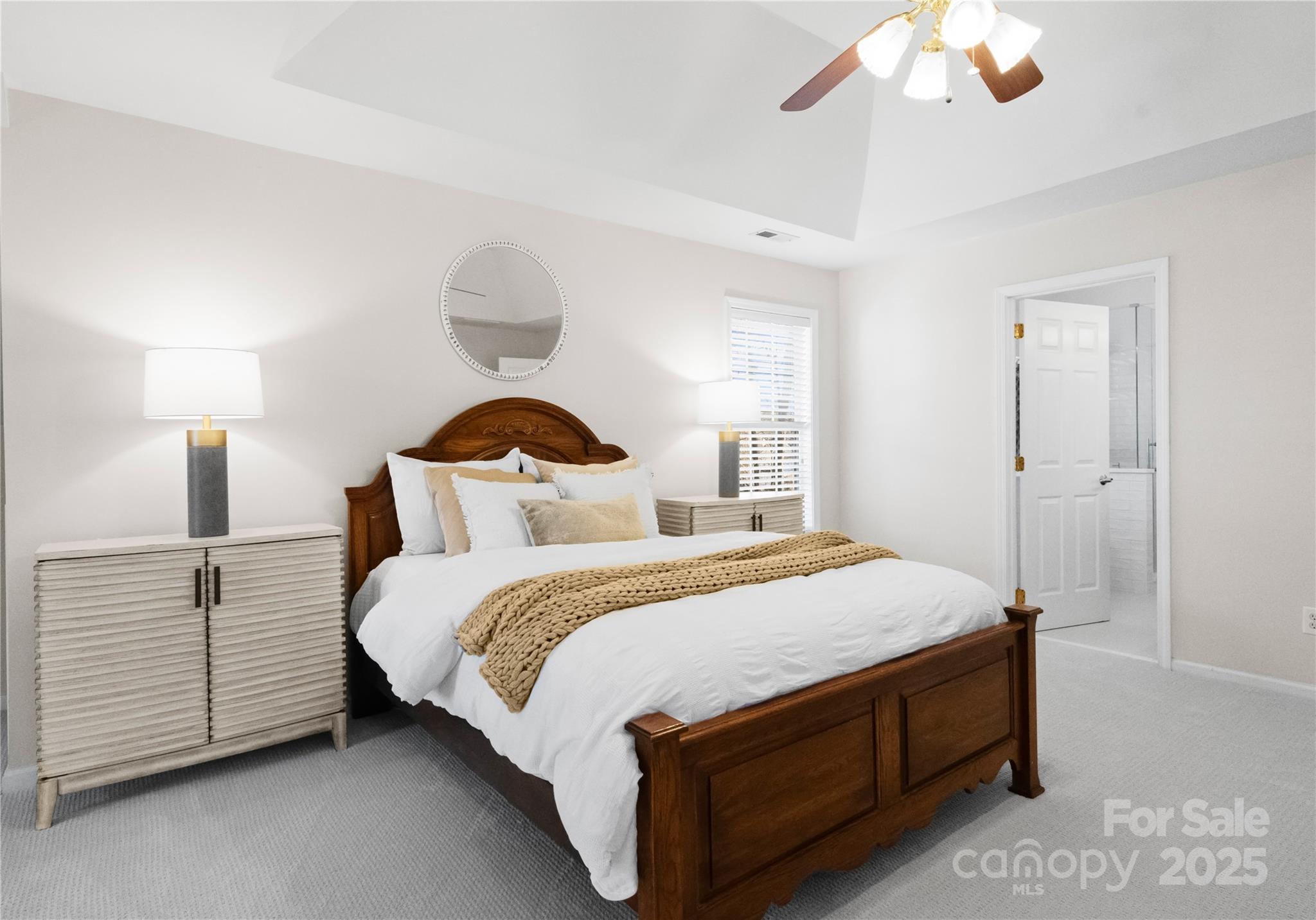 1736 Walnut Crest Lane Matthews, NC 28105 - Photo 24 of 41 a bedroom with bed and a chandelier