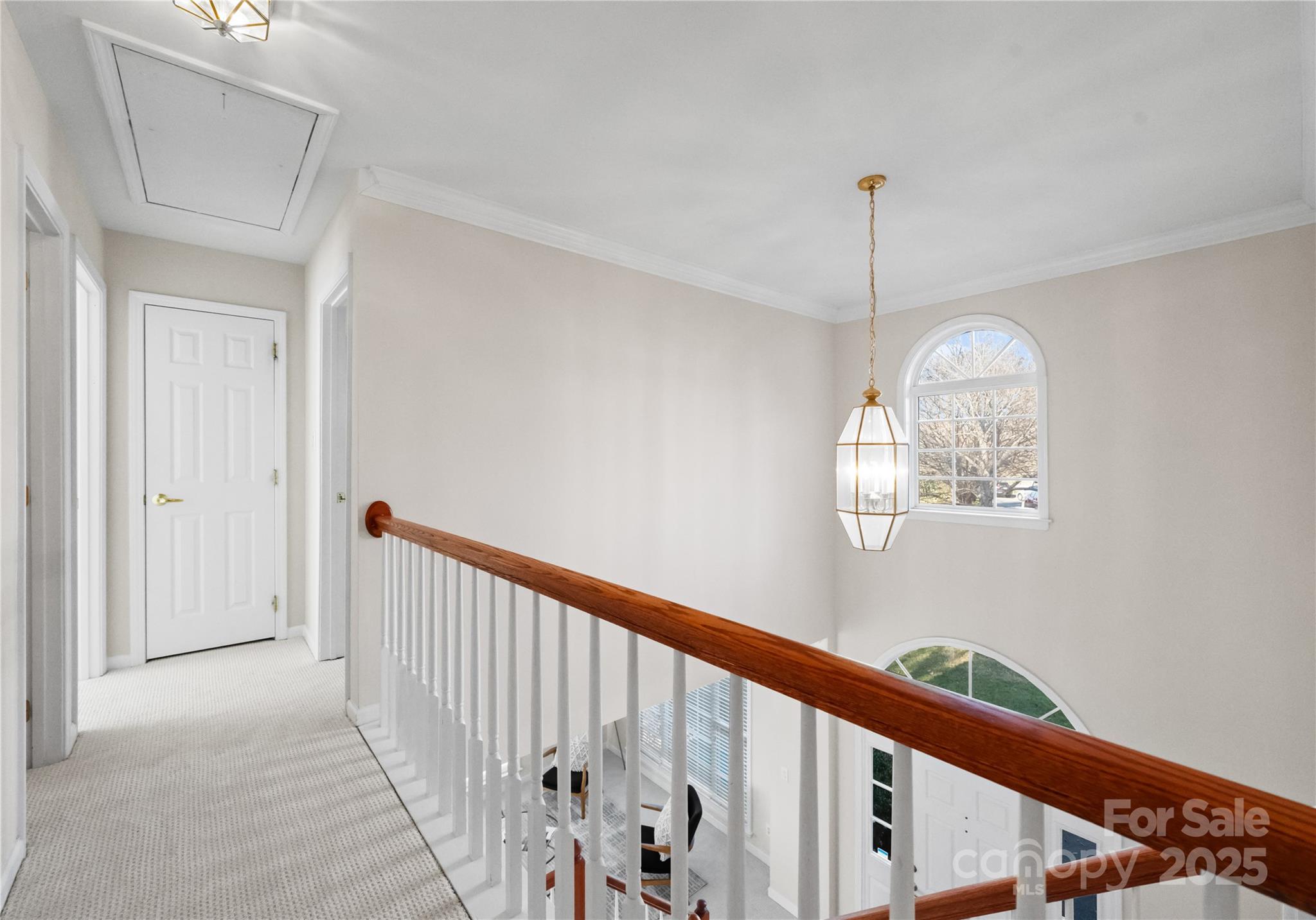 1736 Walnut Crest Lane Matthews, NC 28105 - Photo 36 of 41 a view of a hallway with windows