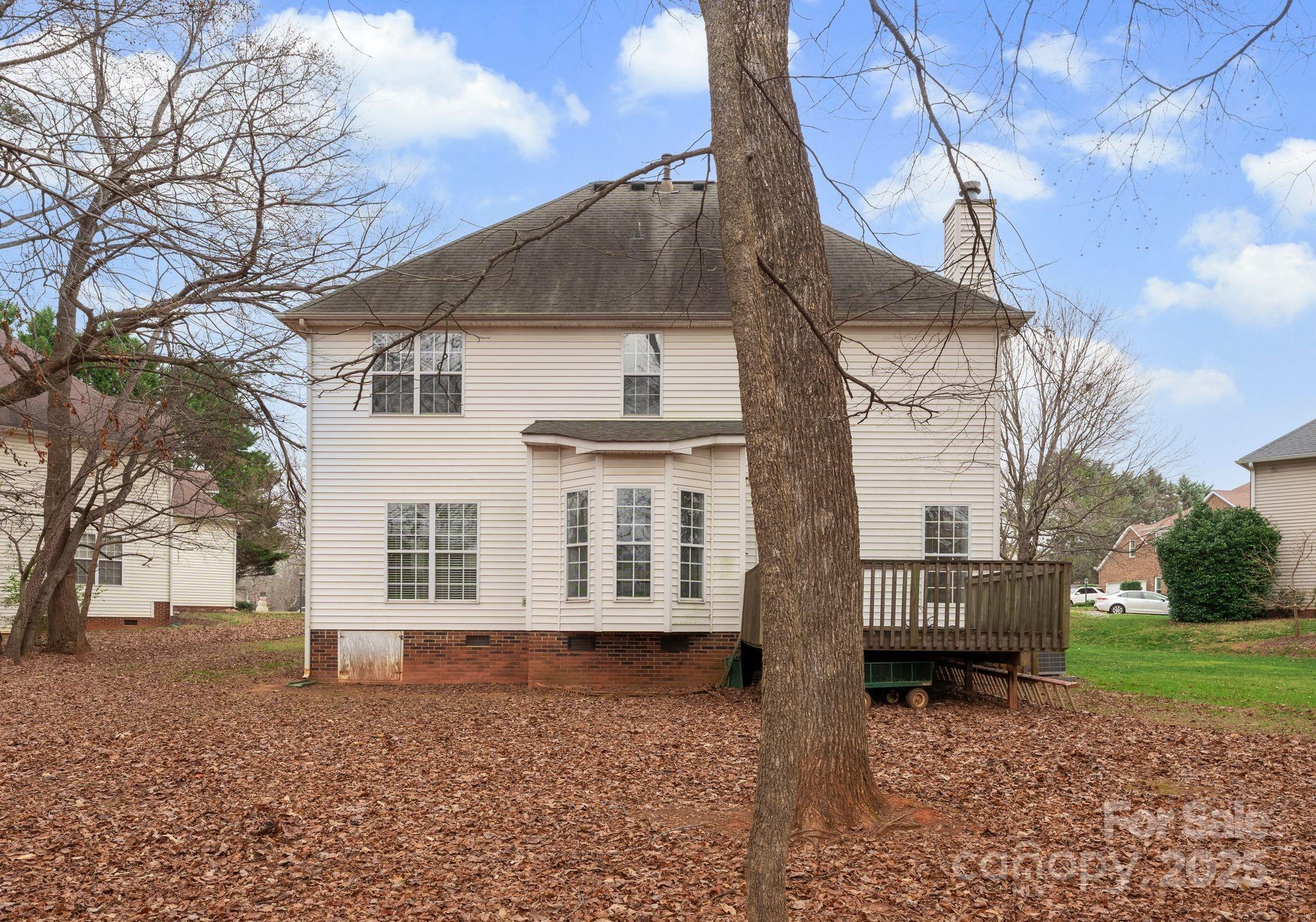 1736 Walnut Crest Lane Matthews, NC 28105 - Photo 39 of 41 a view of a white house with a yard