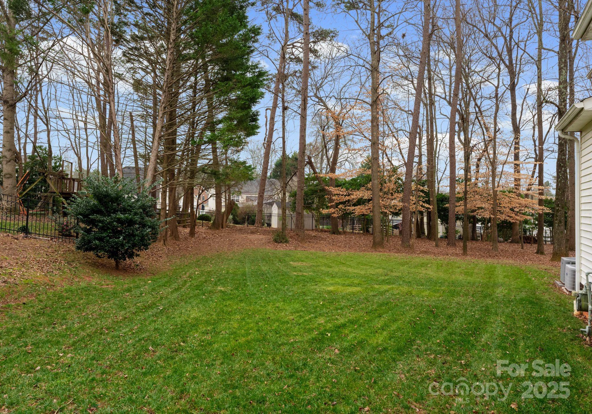 1736 Walnut Crest Lane Matthews, NC 28105 - Photo 4 of 41 a group of people sitting in a yard