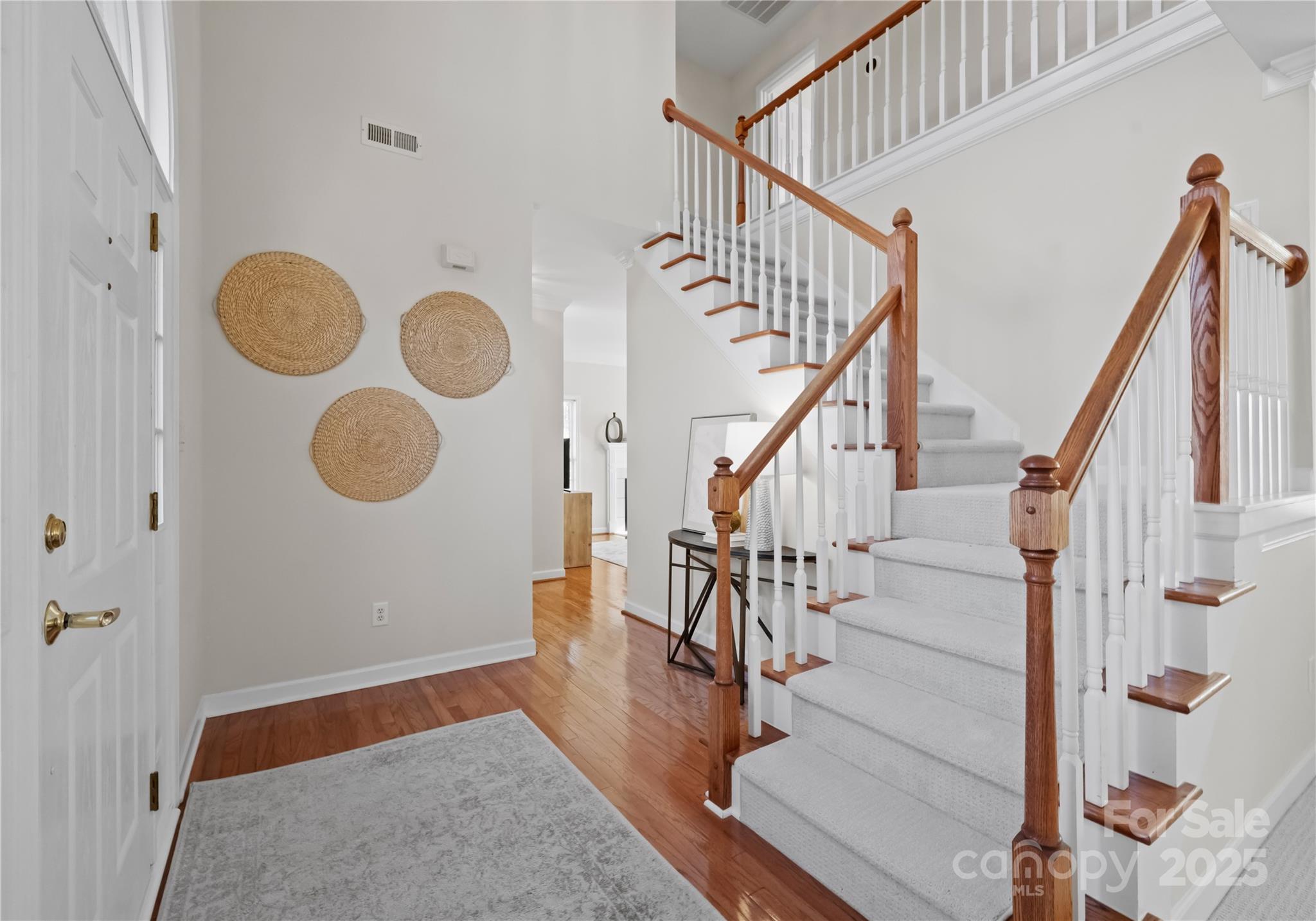 1736 Walnut Crest Lane Matthews, NC 28105 - Photo 5 of 41 a view of entryway and hall with wooden floor