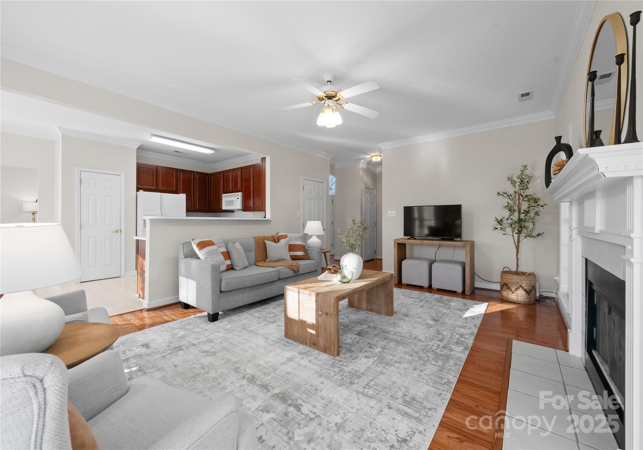 1736 Walnut Crest Lane Matthews, NC 28105 - Photo 8 of 41 a living room with furniture a fireplace and a flat screen tv