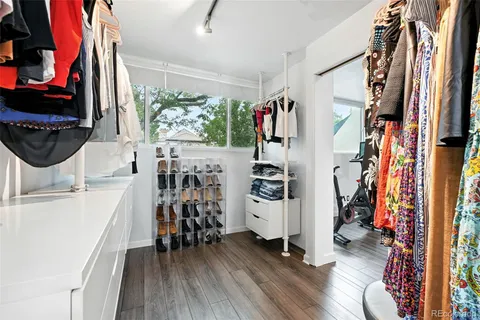 a bathroom with a toilet sink and shower curtain