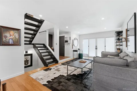 a room with lots of wooden furniture and a fireplace