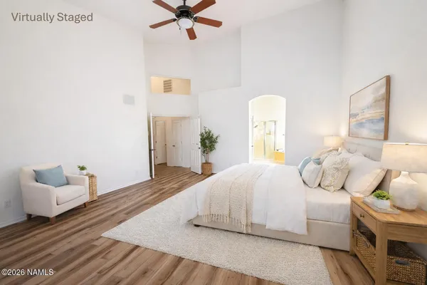 a bedroom with a bed and window