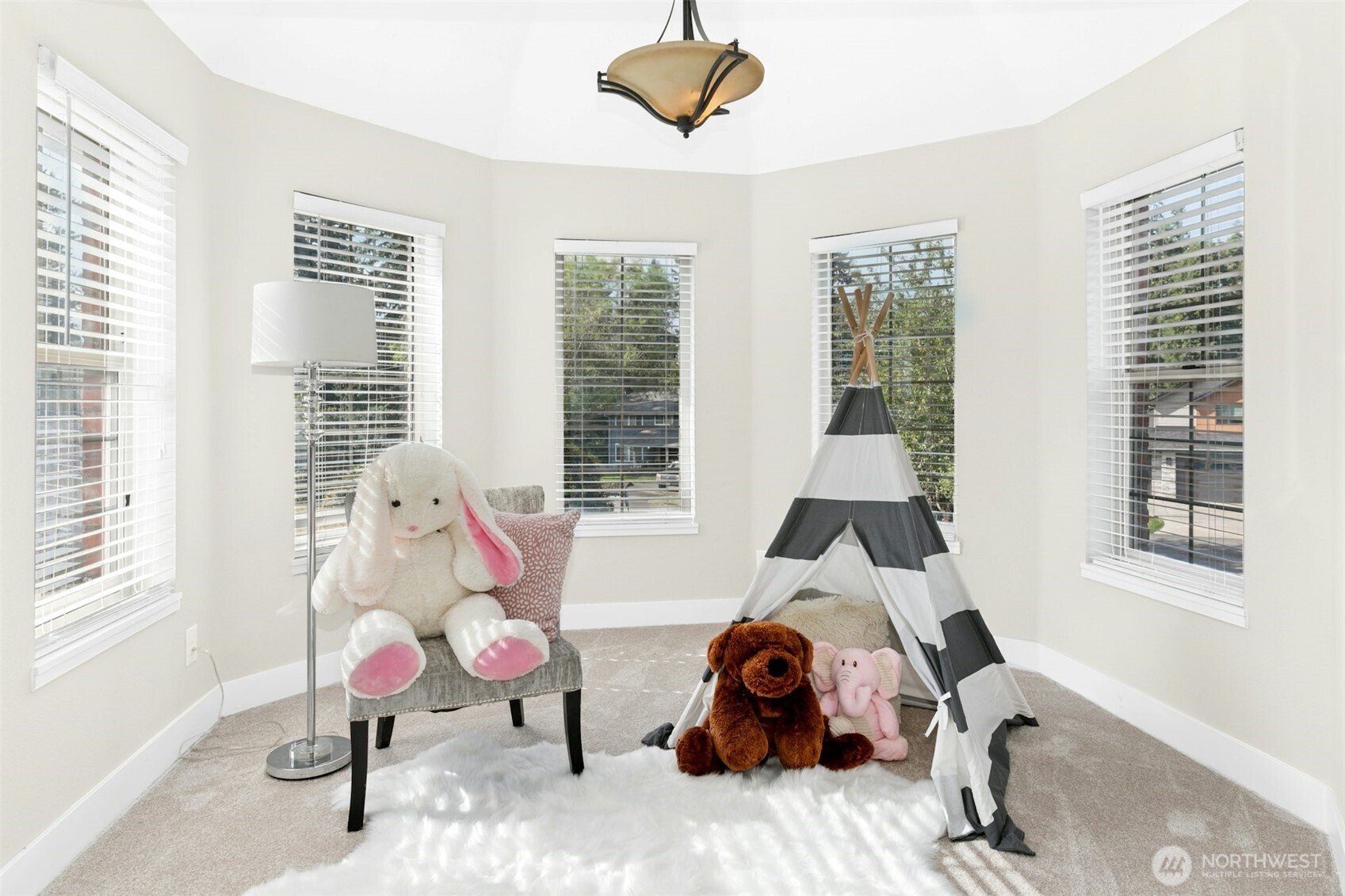 13020 172nd Avenue Southeast Renton, WA 98059 - Photo 24 of 40 a bedroom with furniture and a window