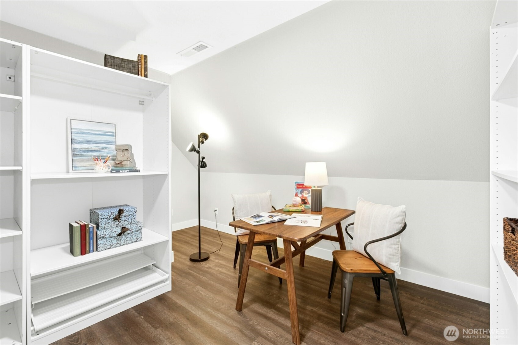 13020 172nd Avenue Southeast Renton, WA 98059 - Photo 25 of 40 a view of a workspace with furniture and wooden floor