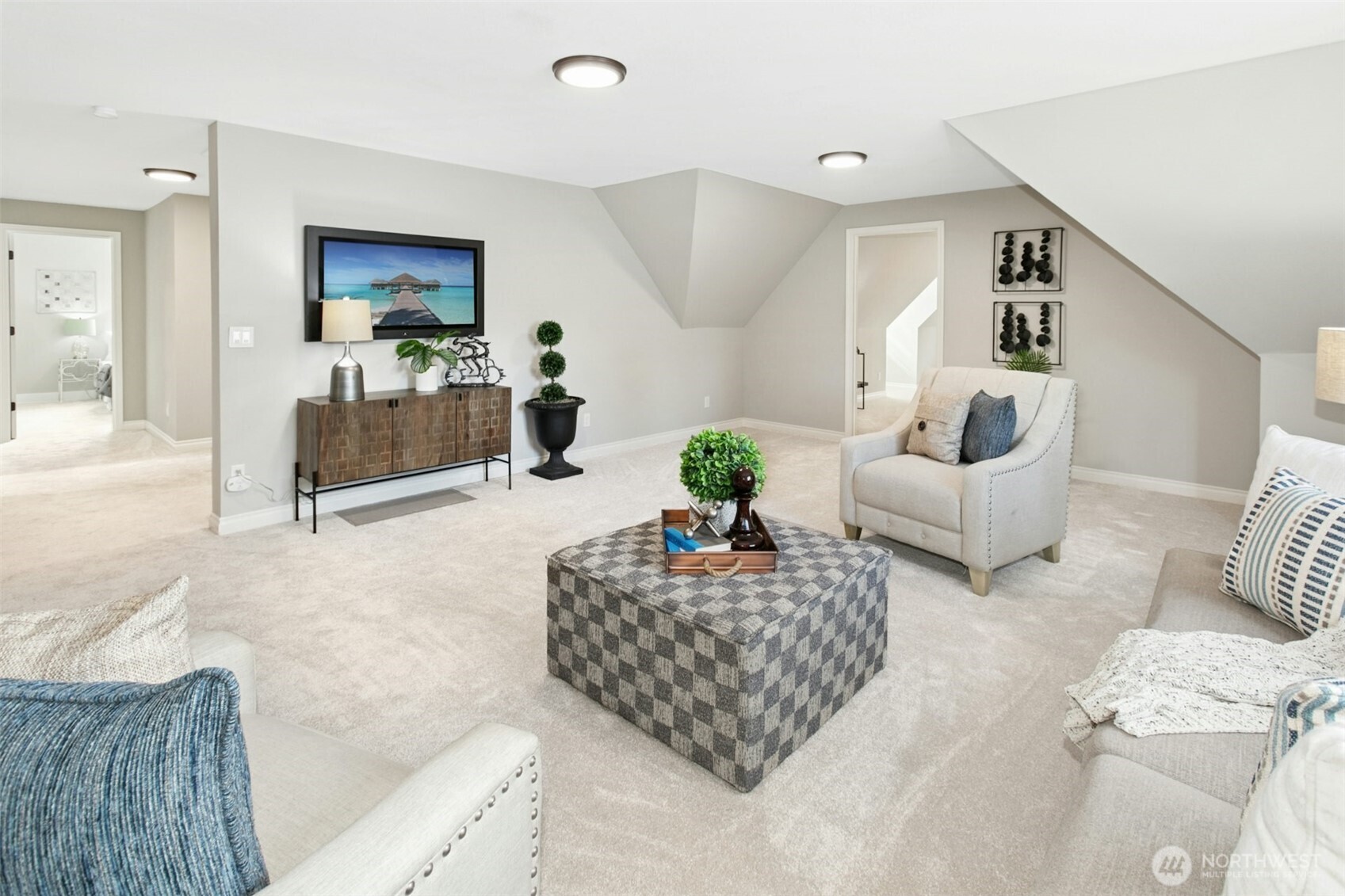 13020 172nd Avenue Southeast Renton, WA 98059 - Photo 28 of 40 a living room with furniture and a flat screen tv