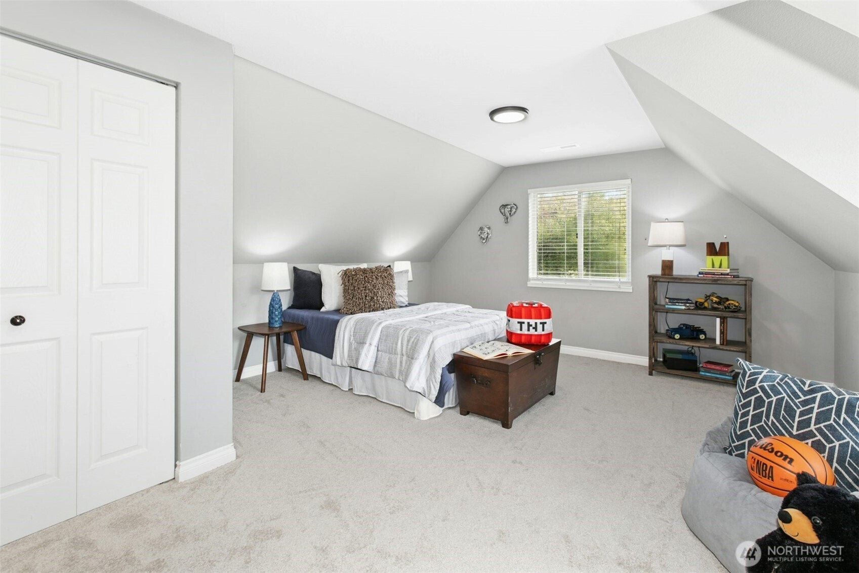 13020 172nd Avenue Southeast Renton, WA 98059 - Photo 30 of 40 a bedroom with furniture and a window