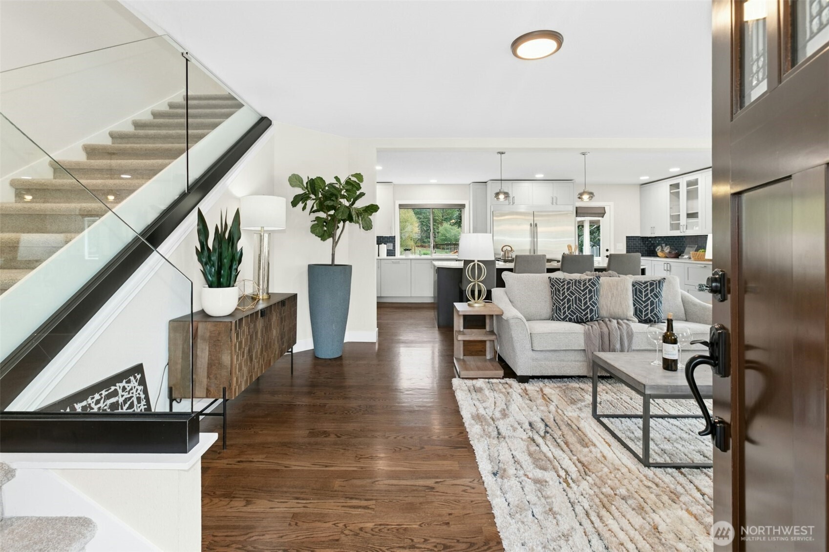 13020 172nd Avenue Southeast Renton, WA 98059 - Photo 6 of 40 a living room with furniture windows and a chandelier
