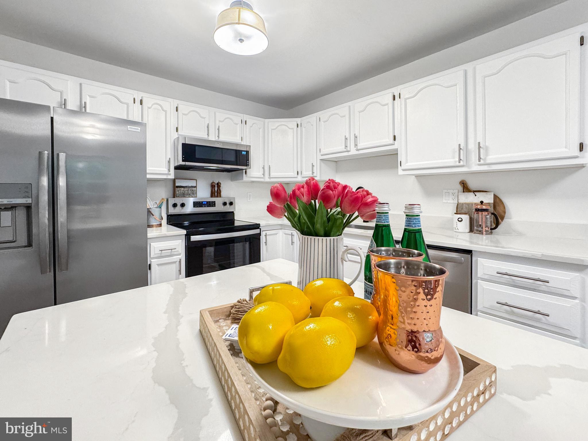640 Santa Fe Trail Lusby, MD 20657 - Photo 12 of 32 a kitchen with granite countertop stainless steel appliances a sink and cabinets