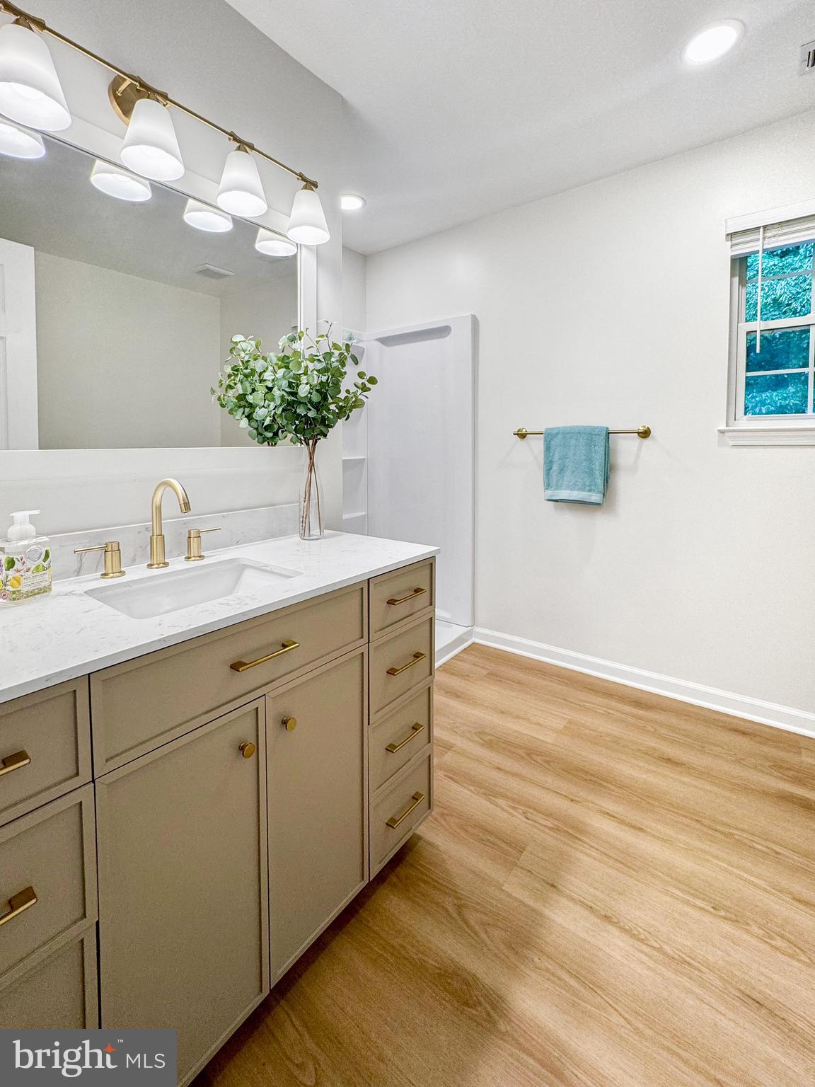 640 Santa Fe Trail Lusby, MD 20657 - Photo 21 of 32 a bathroom with a double vanity sink and a mirror