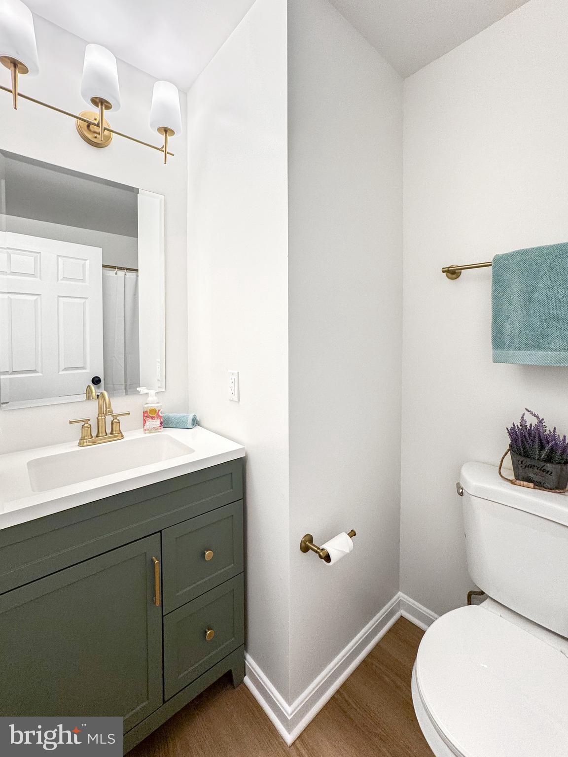 640 Santa Fe Trail Lusby, MD 20657 - Photo 24 of 32 a bathroom with a toilet sink and mirror