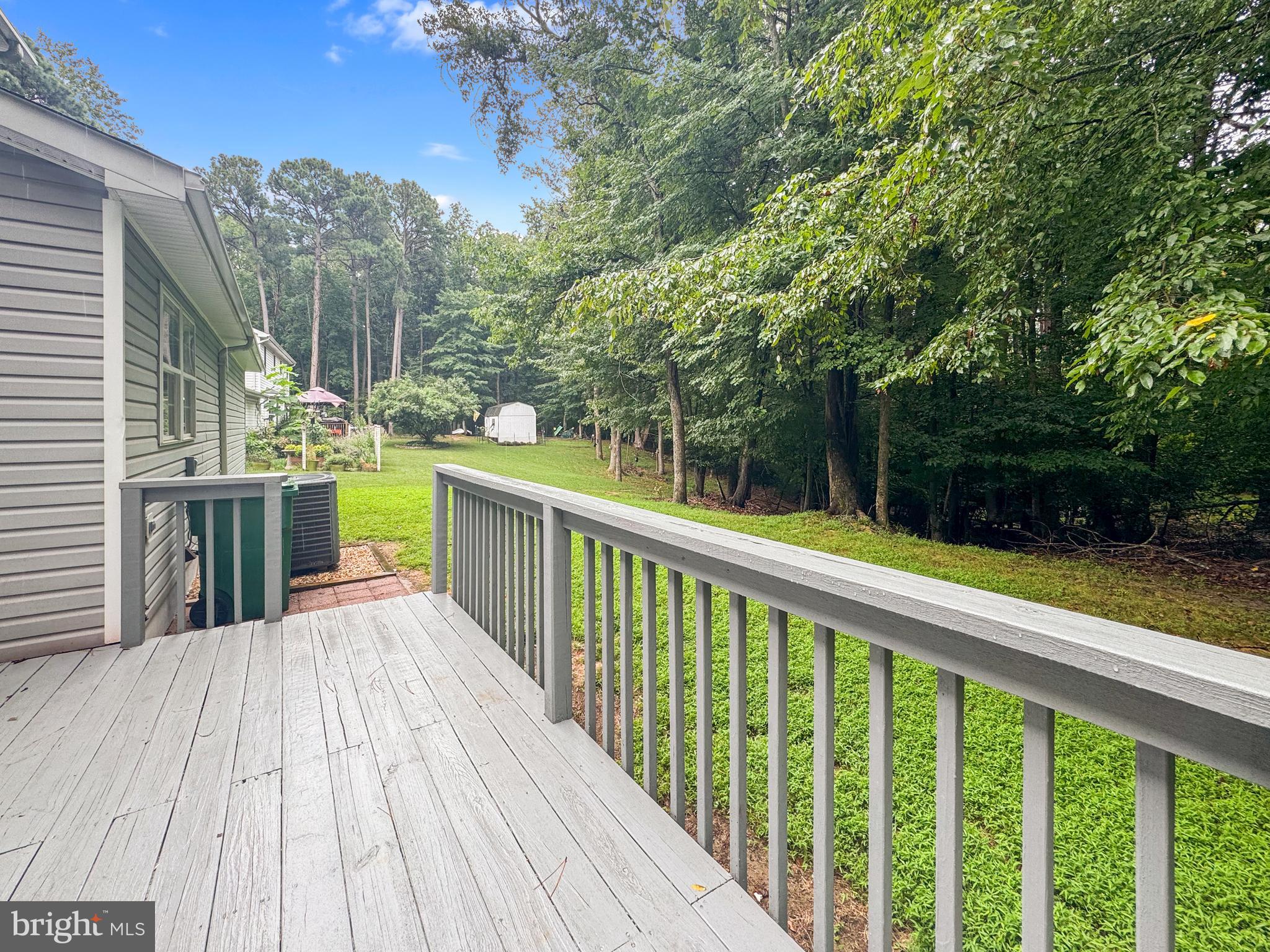 640 Santa Fe Trail Lusby, MD 20657 - Photo 30 of 32 a view of a balcony with wooden floor and fence
