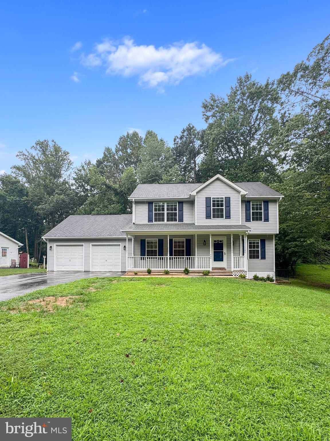 640 Santa Fe Trail Lusby, MD 20657 - Photo 3 of 32 a view of a house with a yard and sitting area