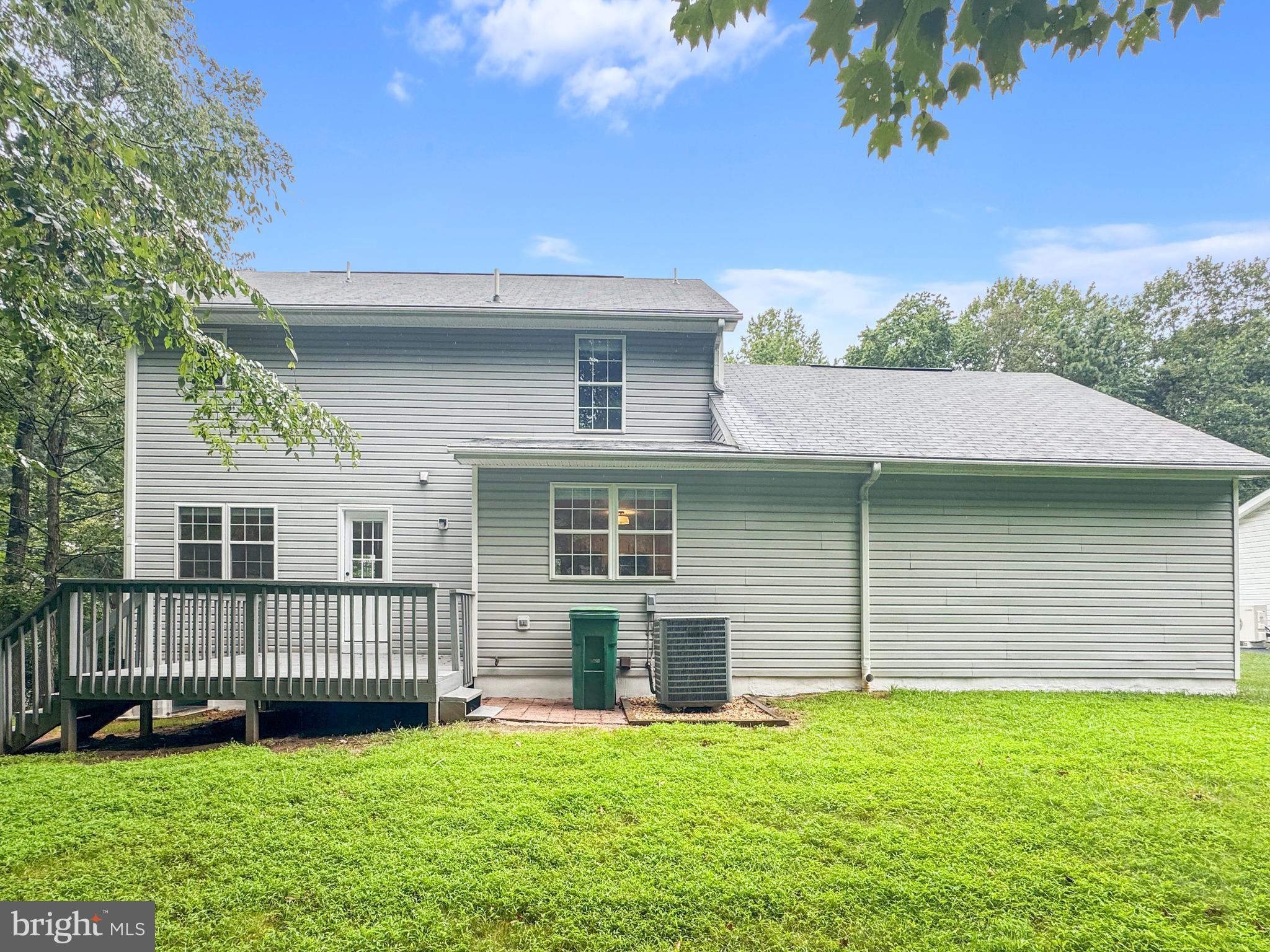 640 Santa Fe Trail Lusby, MD 20657 - Photo 31 of 32 a view of a house with a yard and a large tree