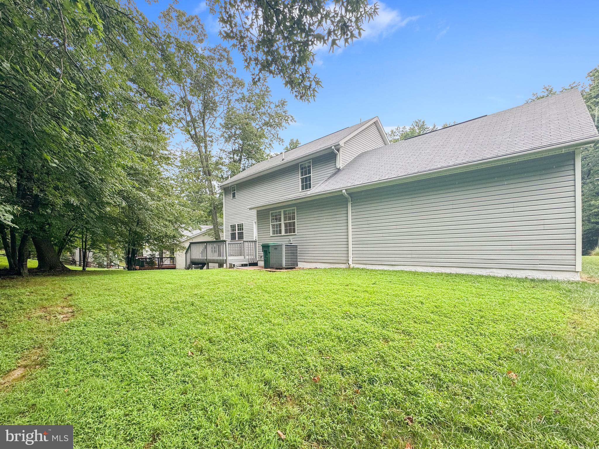 640 Santa Fe Trail Lusby, MD 20657 - Photo 32 of 32 a house with a yard