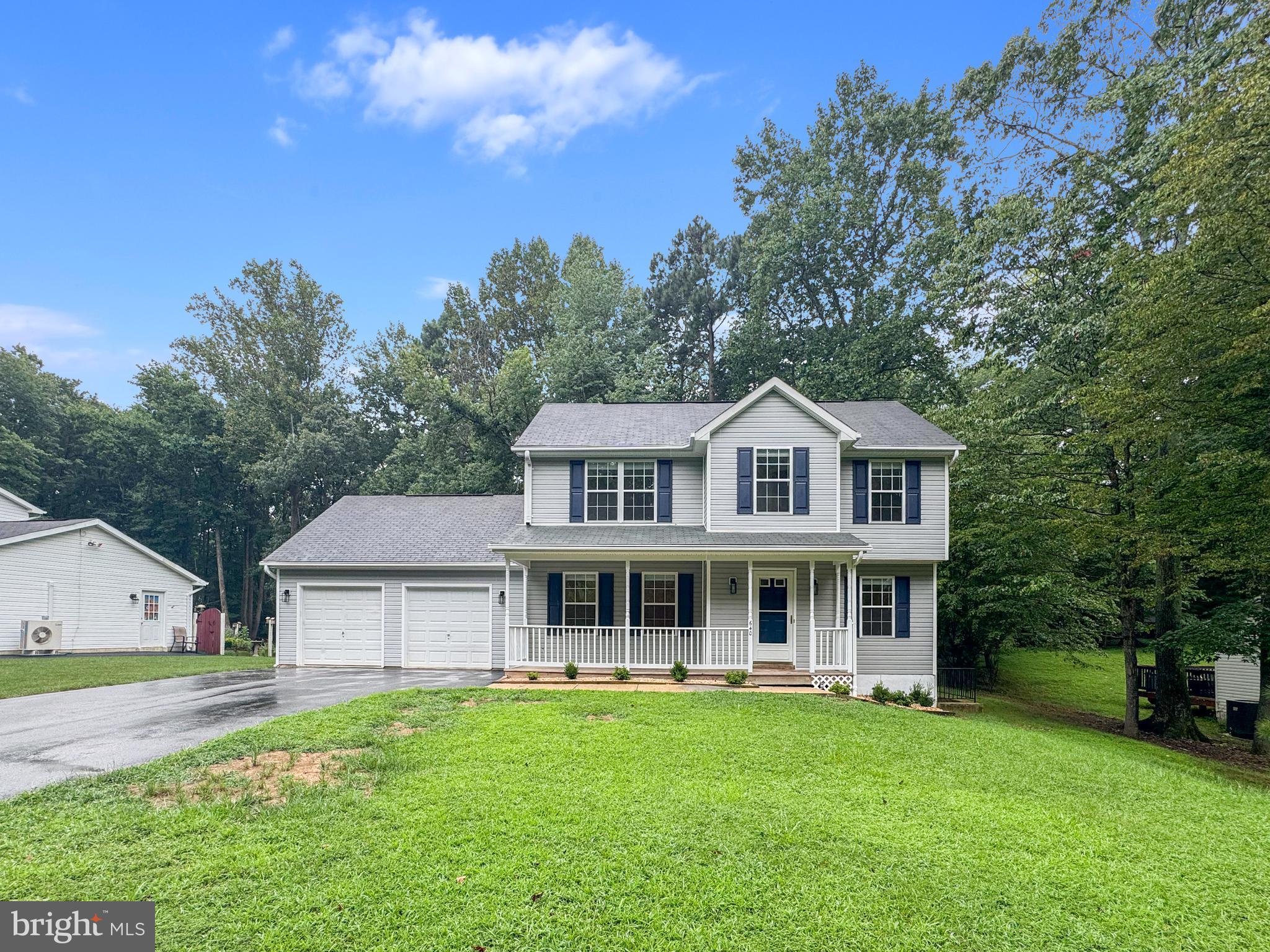 640 Santa Fe Trail Lusby, MD 20657 - Photo 4 of 32 a front view of a house with a garden