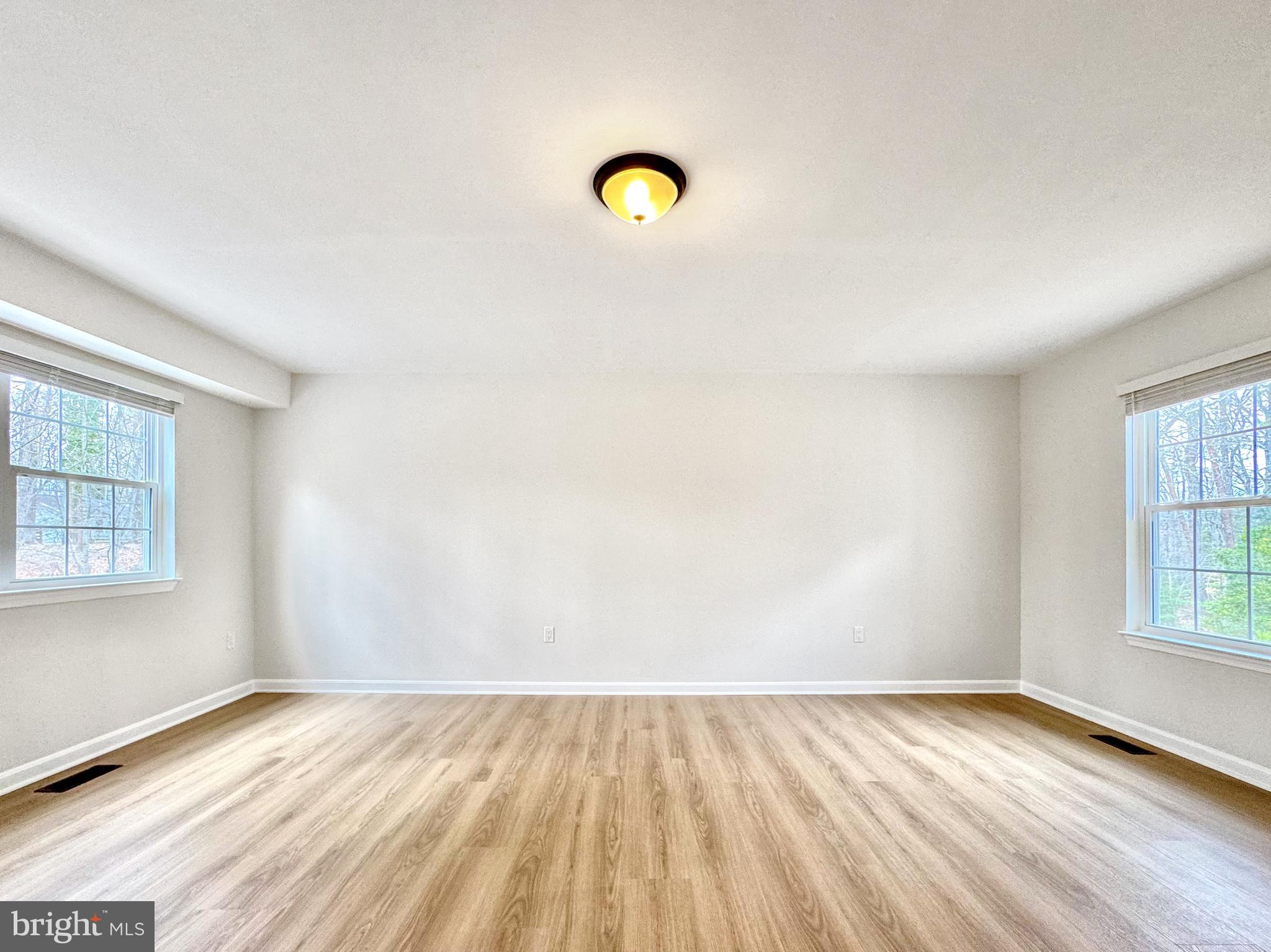 640 Santa Fe Trail Lusby, MD 20657 - Photo 7 of 32 an empty room with a window