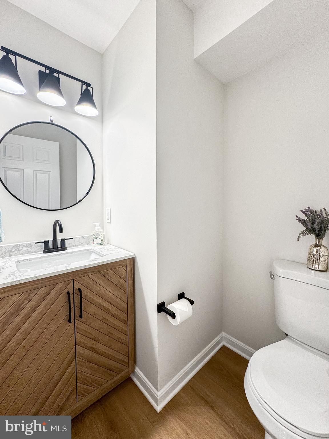 640 Santa Fe Trail Lusby, MD 20657 - Photo 8 of 32 a bathroom with a granite countertop toilet sink and mirror