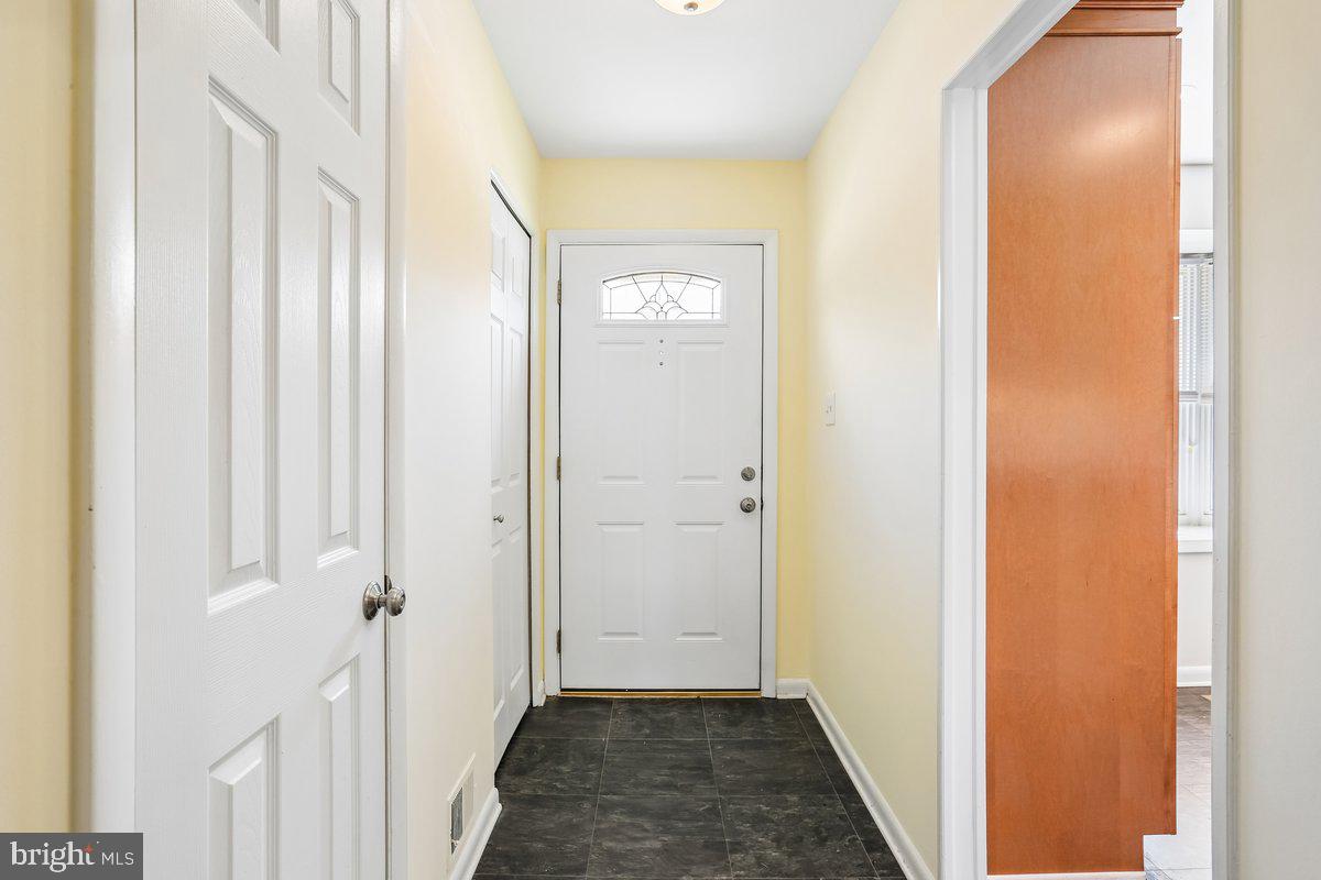 76 Timber Rock Road Gaithersburg, MD 20878 - Photo 8 of 51 a view of a hallway with wooden floor
